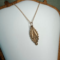 Sprig Medallion Pendant · Bronze