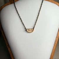 Moss Bib Pendant · Bronze